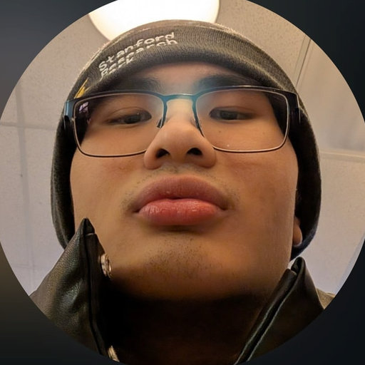Joshua Tanzil, full stack developer, wearing glasses and a knitted cap.